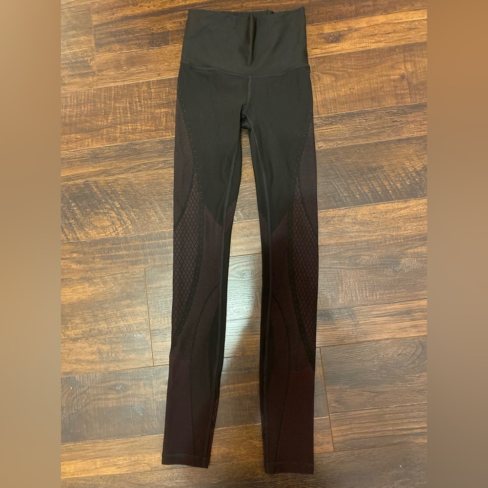 Lululemon black leggings with pink. 28” size 2